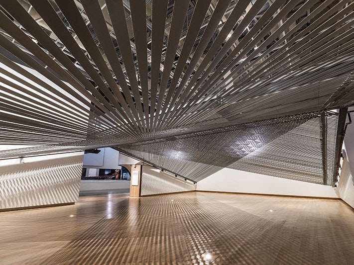 Mataaho Collective, Takapau, 2022, polyester hi-vis tie-downs, stainless steel buckles, j-hooks. Commissioned 2022. Te Papa (8-00101) mataaho-collective-tile.jpg