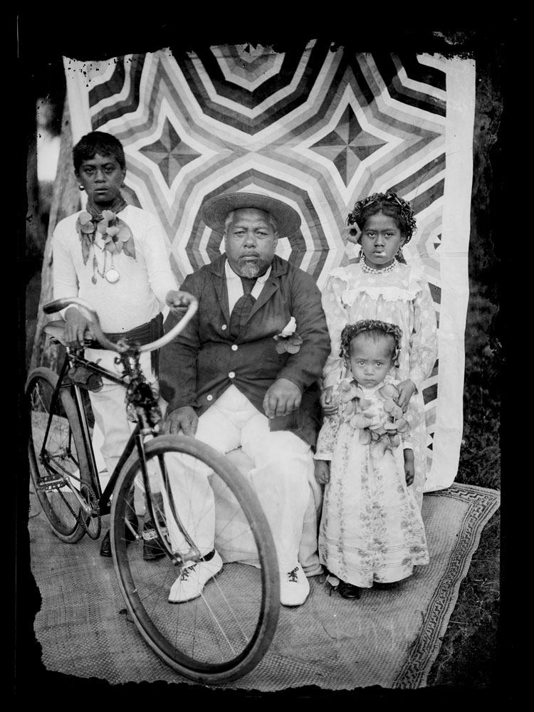 Children sit with their grandfather