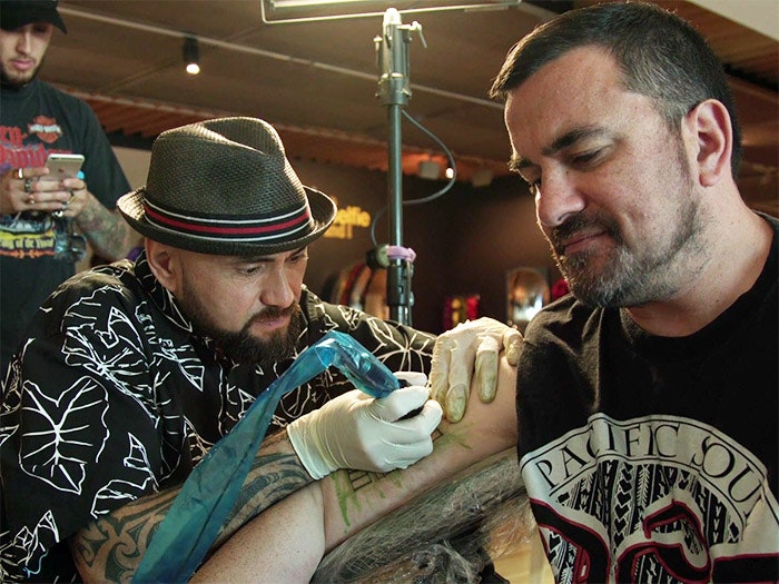Pacific curator Sean Mallon receives a tatau, 2016. Te Papa A man receiving a Samoan tatoo in Te Papa