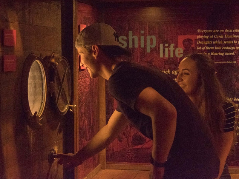 Exploring the Passports exhibition, 2017. Photograph by Rachael Hockridge. Te Papa Visitors explore the Passports exhibition