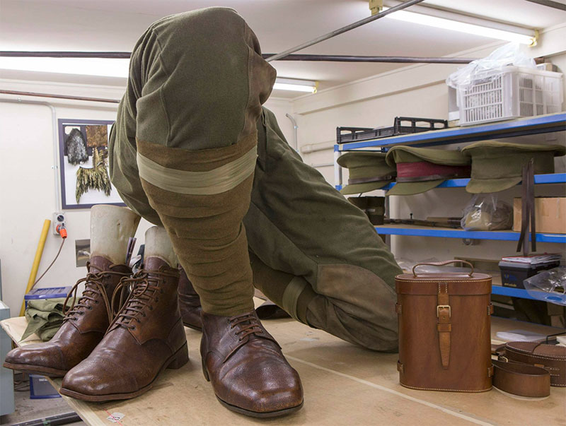 A headless giant body, clothed in a soldiers uniform