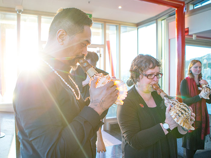 People welcome the taonga onto the marae