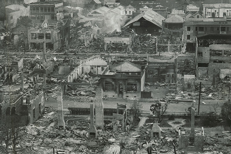 An aerial photo of a city in ruins after an earthquake.