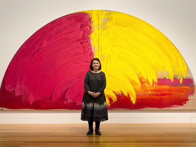 Gretchen Albrecht with her work, In a shower of gold, 2011, acrylic on canvas. Photograph by Michael Hall. Te Papa (2013-0018-1/A-B)