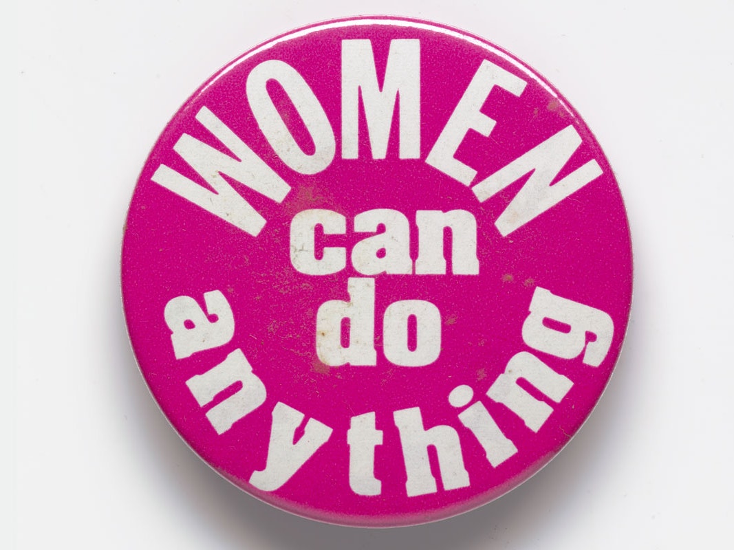 Badge, 'Women can do anything', 1980s, New Zealand, maker unknown. Gift of Anne Else, 2004. Te Papa (GH014496) Pink badge with the words 'Women can do anything'