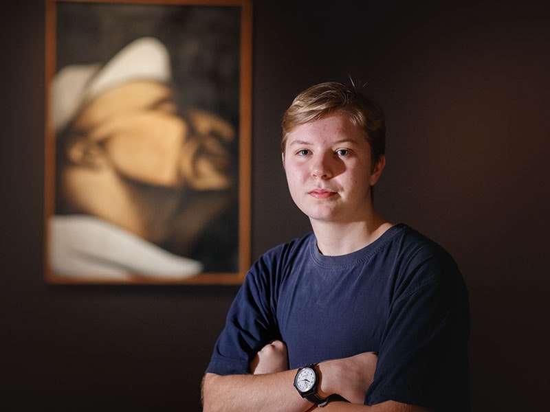 Rose Wallington in front of Tony Fomison, Portrait of a lag (kitchen), 1970, oil on canvas. Te Papa (1972-0037-1) =""