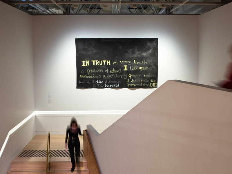 Visitors in Toi Art with Colin McCahon's A grain of wheat, 1970. Photo by Jack Fisher. Te Papa People in an art gallery