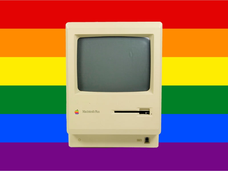 Composite image of Macintosh Plus monitor, 1986, United States, by Apple Computer, Incorporated. Gift of Don Long, 2011. CC BY-NC-ND 4.0. Te Papa (GH021018/1) and Rainbow flag. Public domain Photo of Apple Macintosh computer monitor over top of a rainbo flag