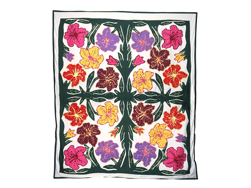 Brightly coloured pacific flowers arranged in a symmetrical pattern on a white background