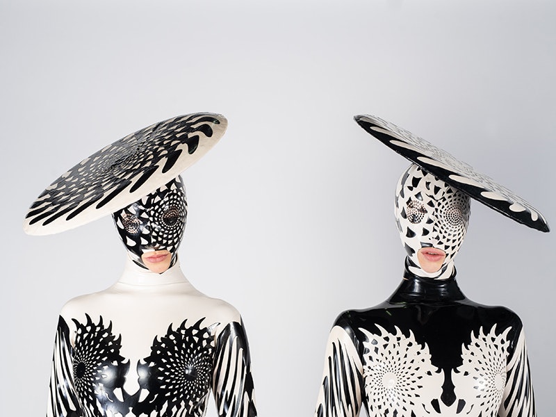 Gemini: The Twins, Dawn Mostow & Ben Gould, United States. Image courtesy of World of WearableArt Ltd Two people wearing black and white costumes