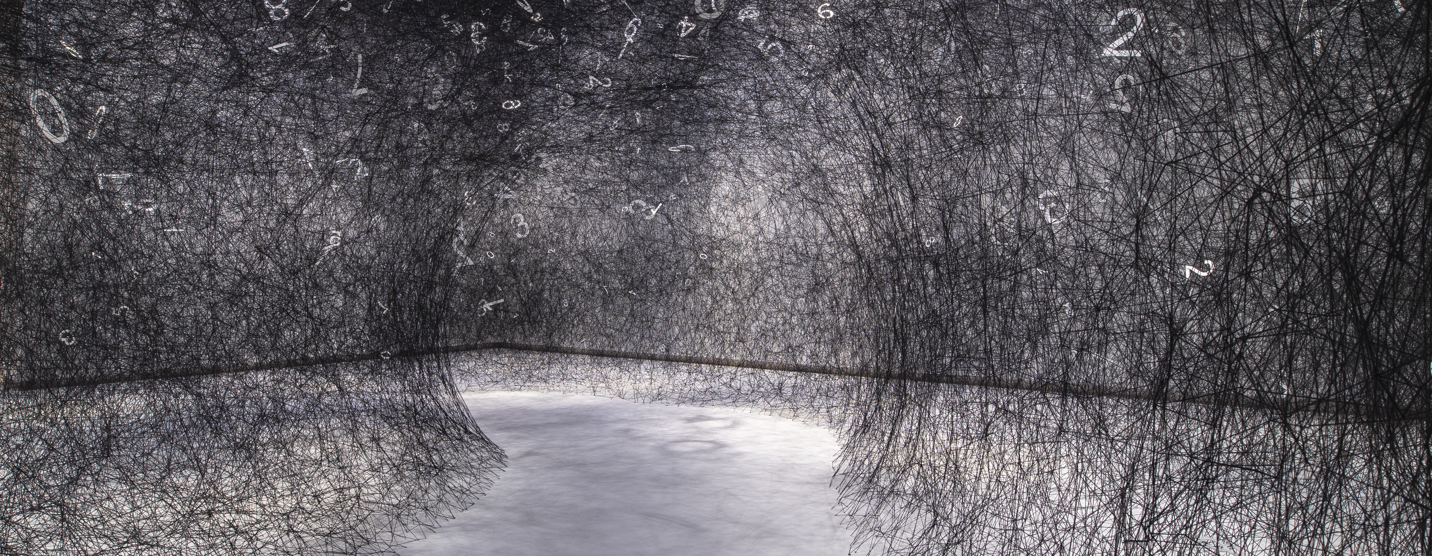 Black wool in a web stretched across a museum gallery floor, with white numbers sitting in random parts of it. There's a path through it for people to walk through.