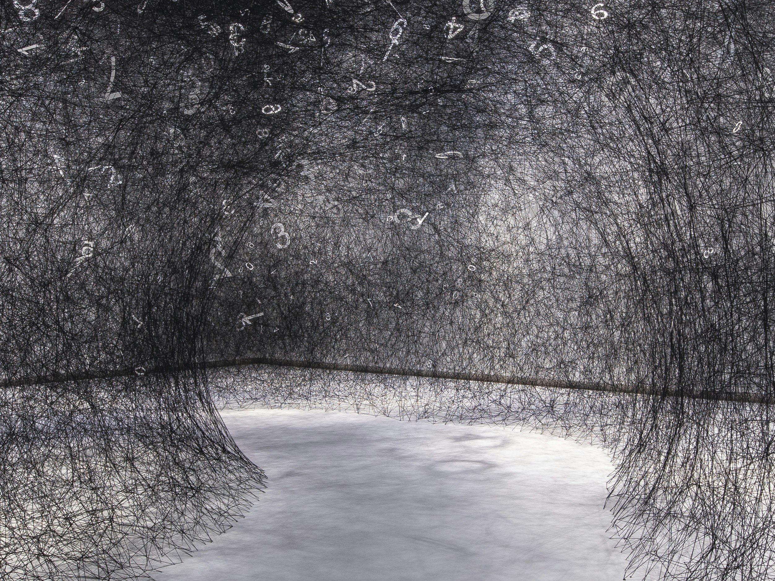 Chiharu Shiota, The Web of Time, Toi Art, 2020. Photo by Michael O'Neill. Te Papa Black wool in a web stretched across a museum gallery floor, with white numbers sitting in random parts of it.