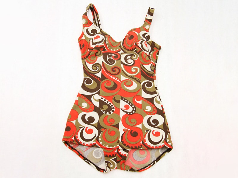 Bathing costume, woman's, circa 1965-1975, New Zealand, by Canterbury of New Zealand Ltd. Purchased 2008. CC BY-NC-ND 4.0. Te Papa (GH015897) A brown, orange and white bathing suit on a white background