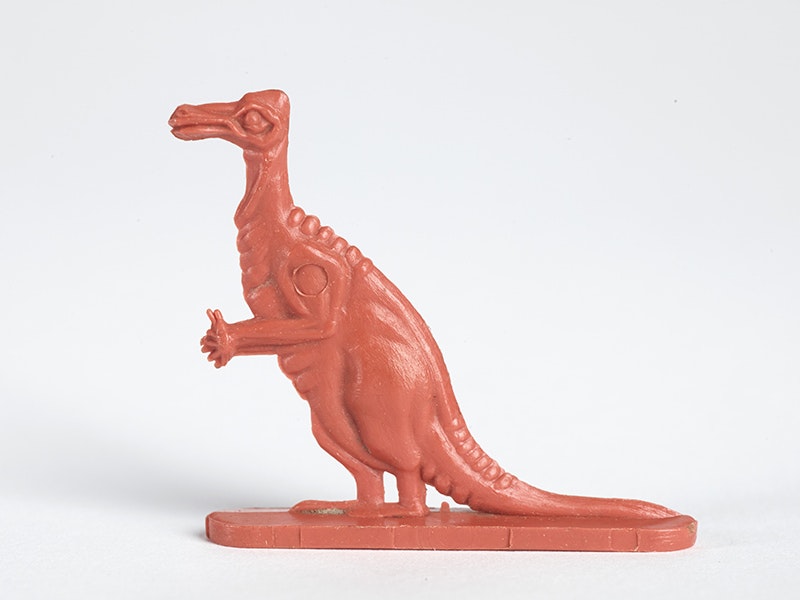 Plastic cereal collectible, Iguanodon, 1962, by Nabisco. Gift of Christine Kiddey, 2011. CC BY-NC-ND 4.0. Te Papa (GH021038/10) An orange plastic dinosaur that came in a cereal box in the 60s