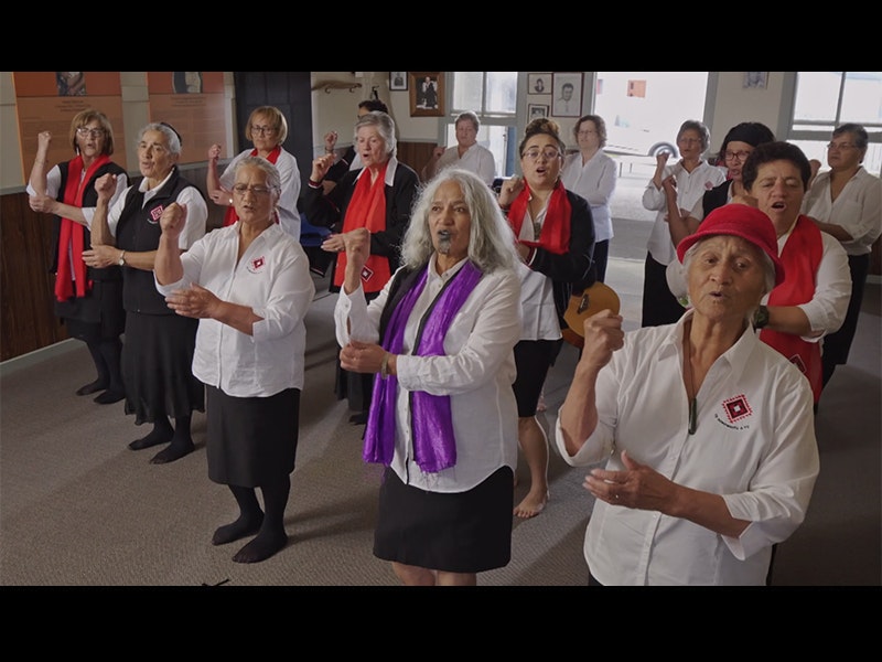 Still from video courtesy of Ngā Taikura o Te Hokowhitu a Tu Women in a group dancing with actions