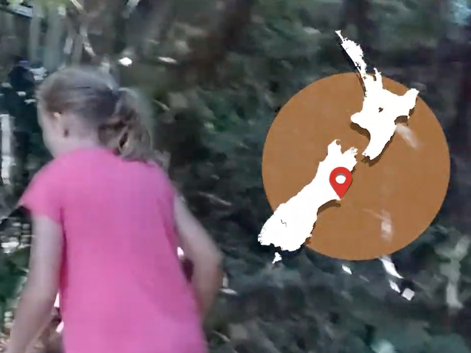 Video still from Possum trapping, Banks Peninsula. Te Papa A girl in a pink tshirt is walking off screen and there's a map of New Zealand overlaid on the top right