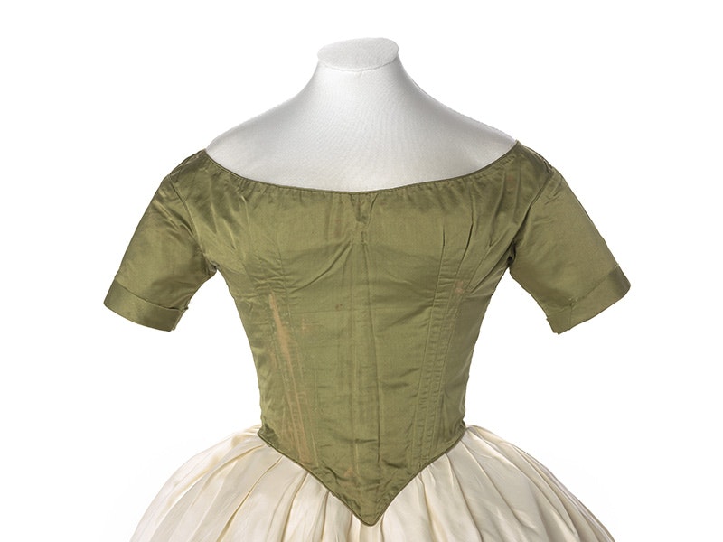 Bodice, 1844, maker unknown. Gift of JC Nicholls, 1958. CC BY-NC-ND 4.0. Te Papa (PC000034) A green bodice from an 1880s garment on a white background