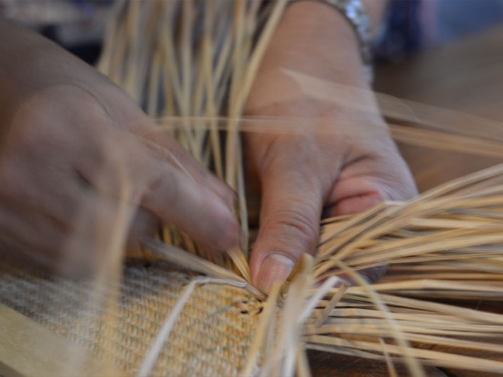 Hands weaving. Photo by Wei-Cheng Wu via Unsplash Close up of weaving