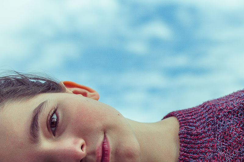 Close up of a young woman’s face, horizontally, cropped so you can only see half of it