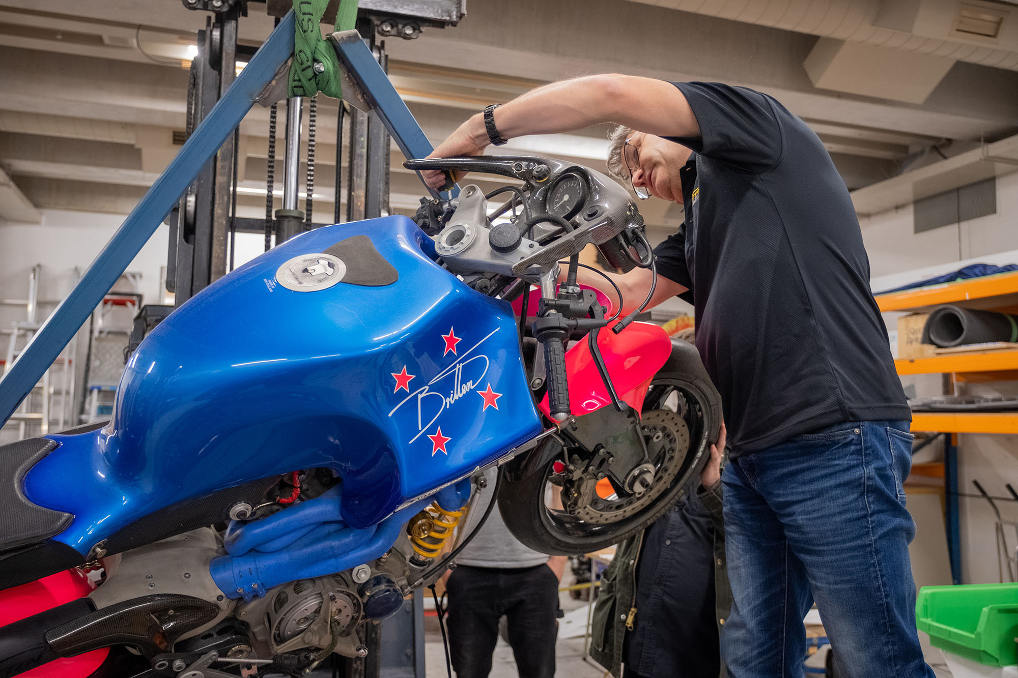 Craig removes more bodywork from the front of the bike, above the front tyre