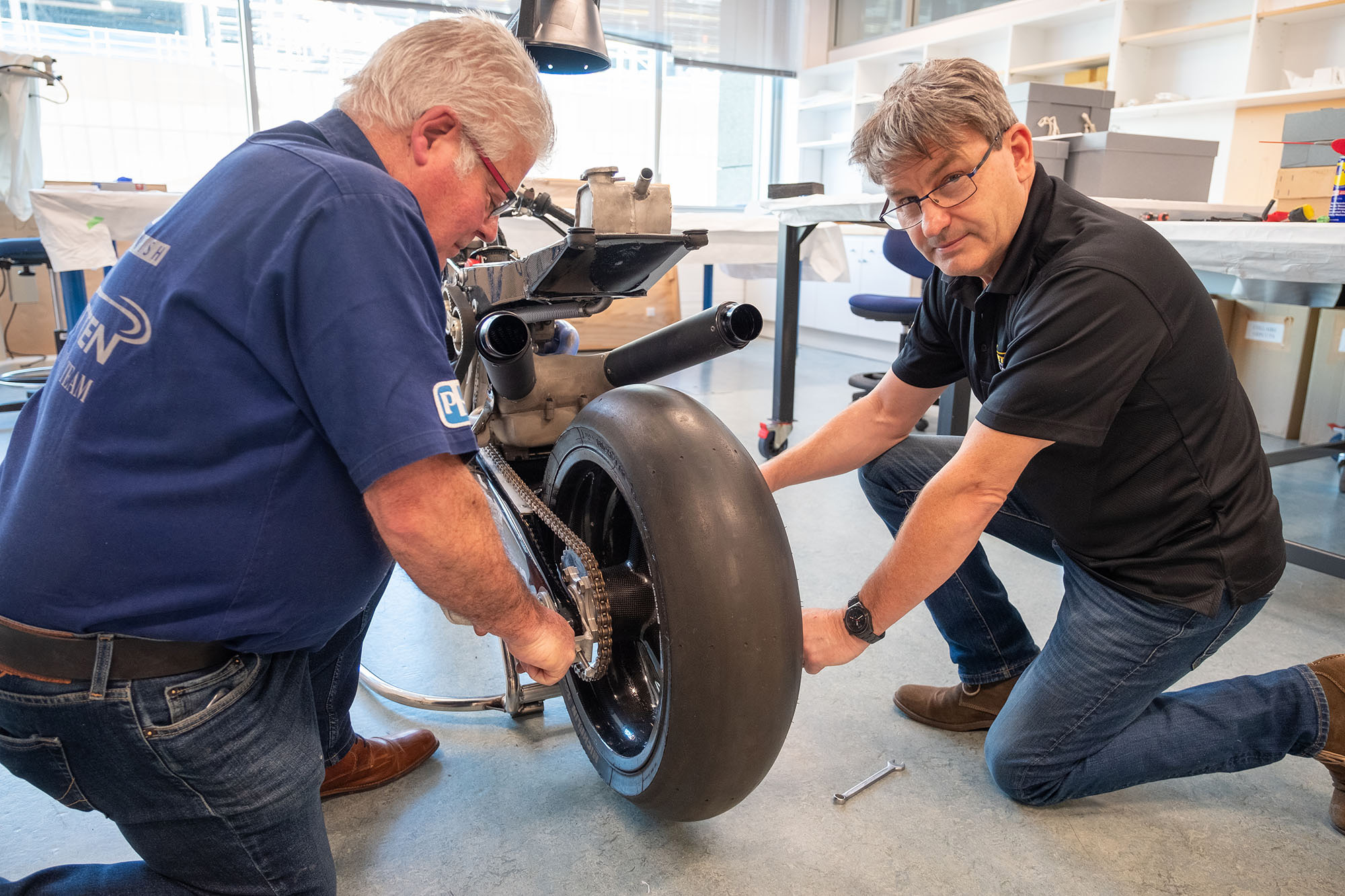 Bob and Craig align the rear wheel of the Britten Bike