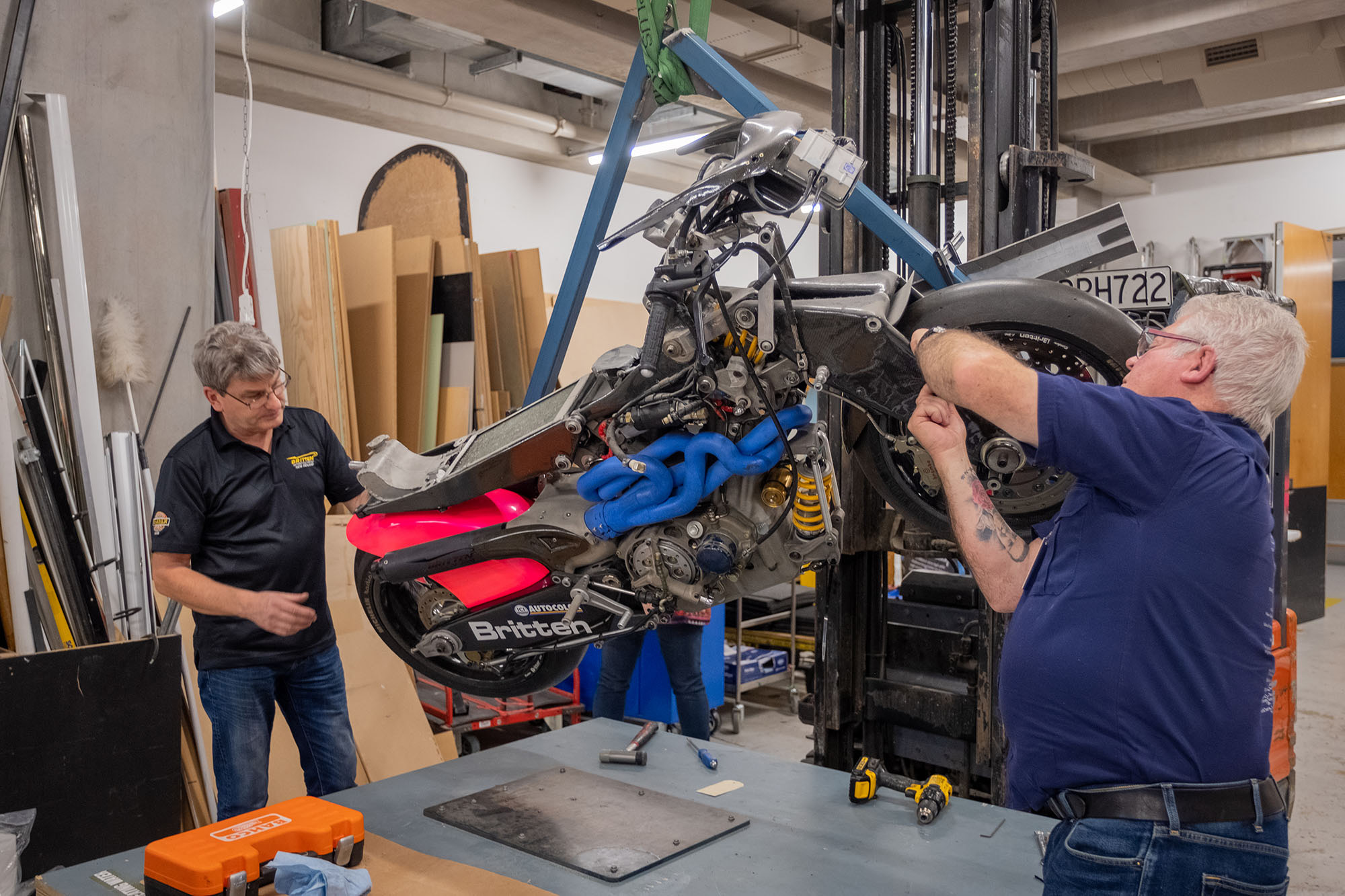 Bob works on a part of the bike exposed by the removed front mudguard