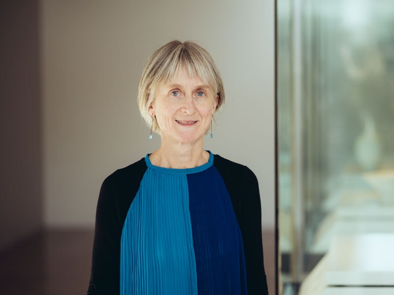 Stephanie Gibson, 2017. Photograph by Tim Onnes. Te Papa A woman with short hair is standing and smiling at the camera.