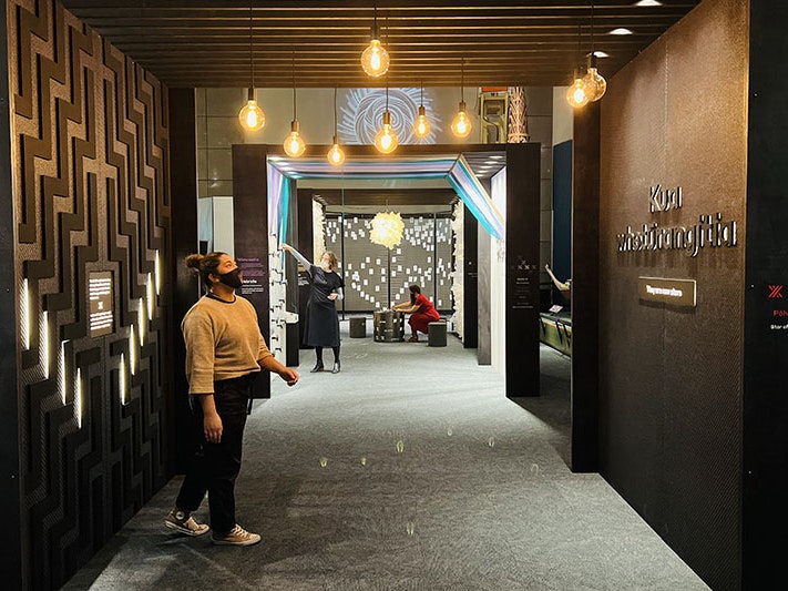 Visitors in the Matariki Experience, 2022. Photo by Daniel Crichton-Rouse. Te Papa Three people explore the three areas in the Matariki Experience at Te Papa