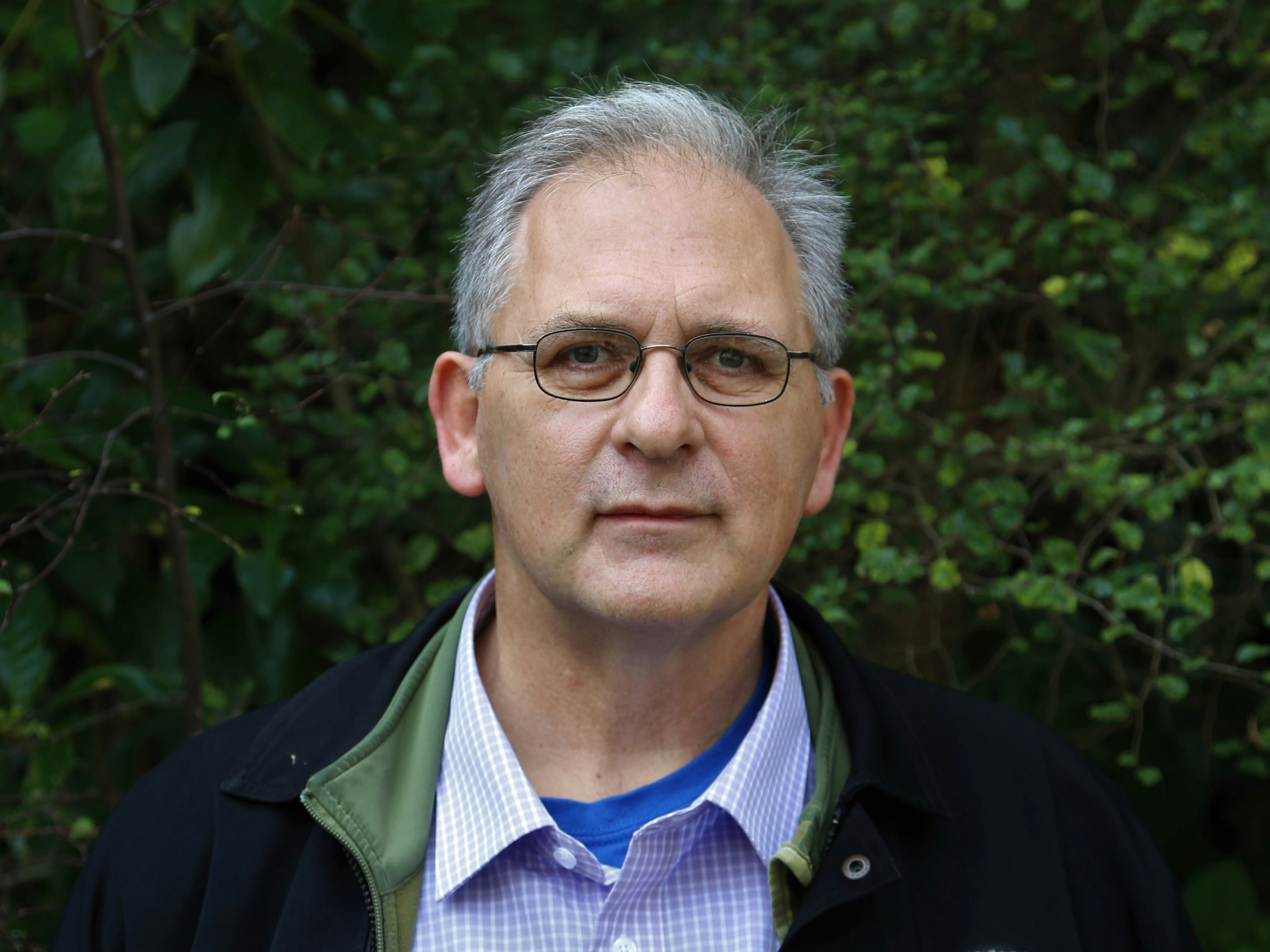 Michael Szabo. Photo courtesy of the author A head and shoulders photo of a man in front of a hedge