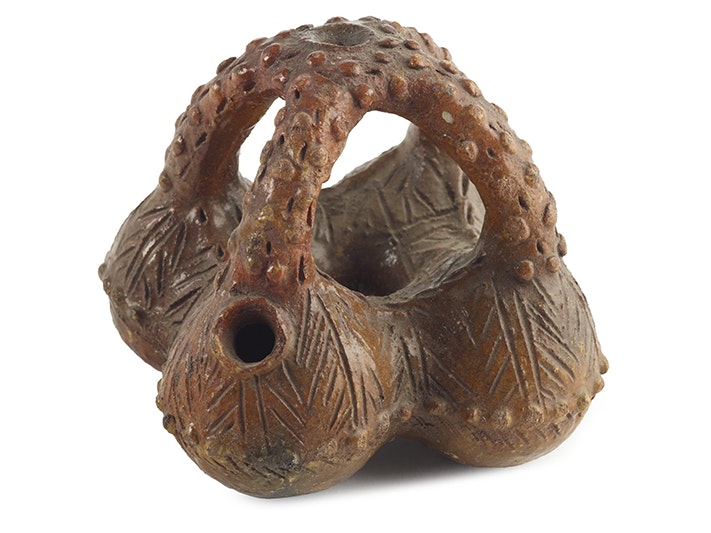 Jar, Fiji, maker unknown. Augustus Hamilton Collection. Purchased 1914. CC BY-NC-ND 4.0. Te Papa (FE000185) A ceramic pot with four looping handles and four containers