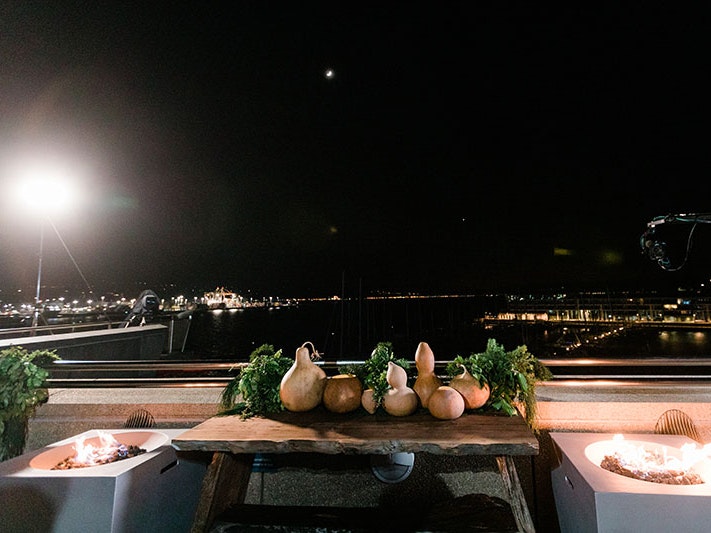 The setup for the inaugural Matariki hautapu at Te Papa, 24 June 2022. Photo by Erica Sinclair. Te Papa A selection of gourds on a table at Te Papa overlooking Wellington Harbour. The sun has not yet risen, and cameras hover in the air ahead of broadcasting of the ceremony