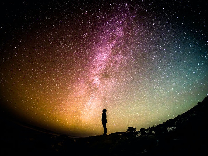 A man looking towards a starry sky, 2015. Photo by Greg Rakozy / Unsplash A man looking up towards the starry sky