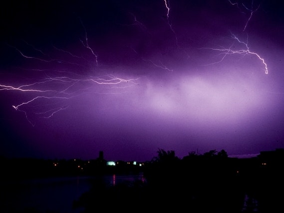 Brian Brake, China Series: Electric storm at Xin Feng, 1957-1959. Gift of Mr Raymond Wai-man Lau, 2001. Te Papa (CT.042253 Photograph of a vivid purple Electric storm