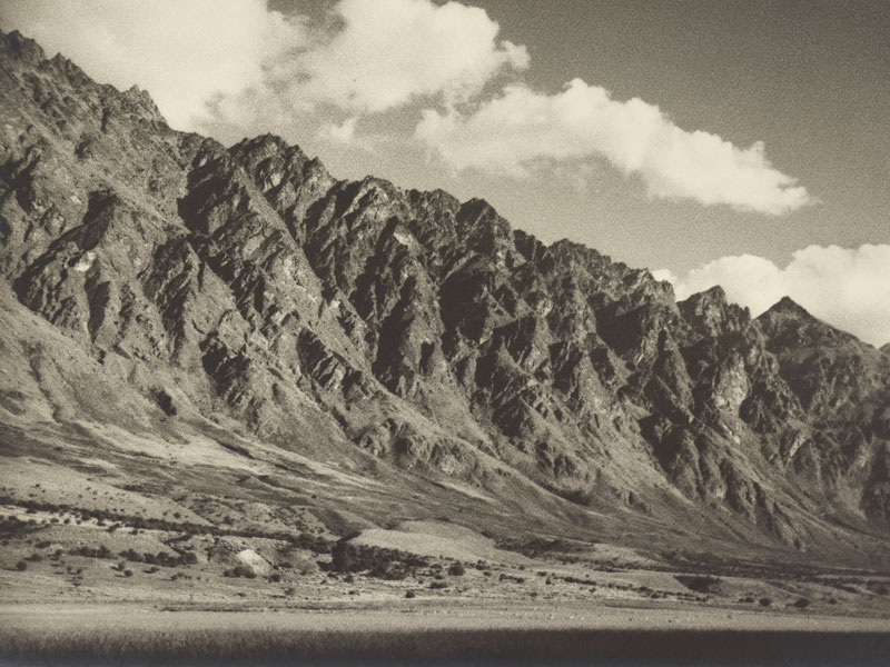 Black and white photo of craggy mountain tops