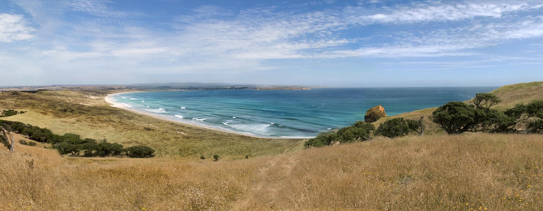 Distant photograph of a beach on a relatively clear day