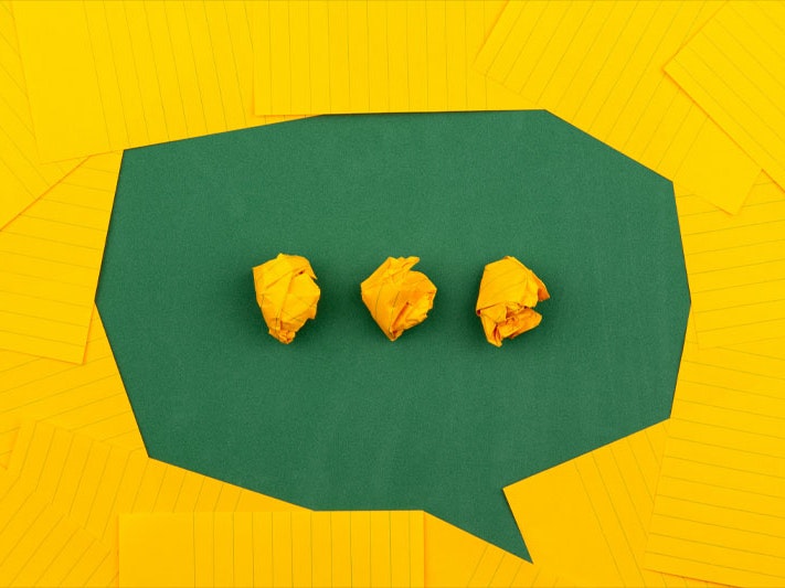 Volodymyr Hryshchenko, three crumpled yellow papers on green surface surrounded by yellow lined papers, 2019. Unsplash Three crumpled yellow papers on green surface surrounded by yellow lined papers suggesting a thinking bubble