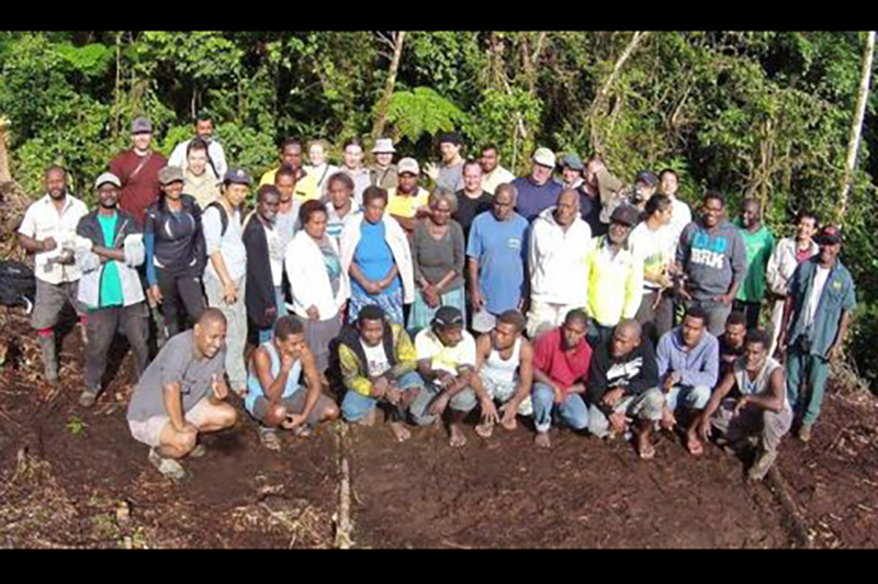 A large group of people arranged for a group photo