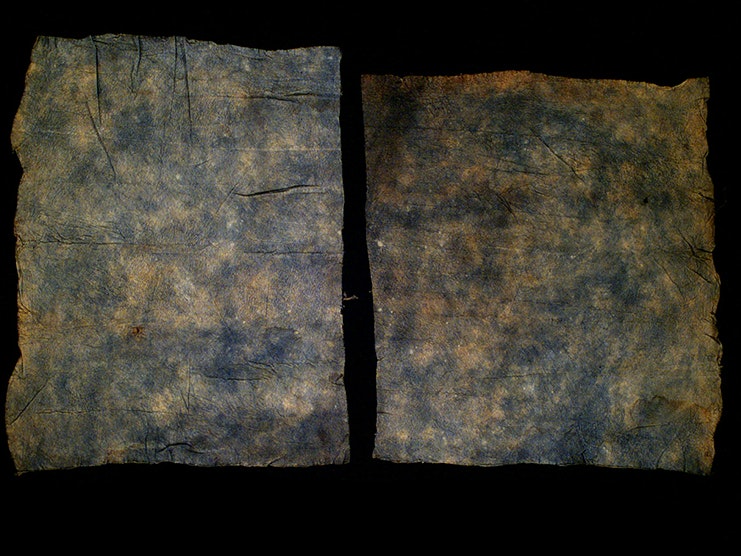 Barkcloth (tapa cloth), Solomon Islands. Oldman Collection. Gift of the New Zealand Government, 1992. Te Papa (OL002309/2) Two pieces of blue tapa cloth on a black background.