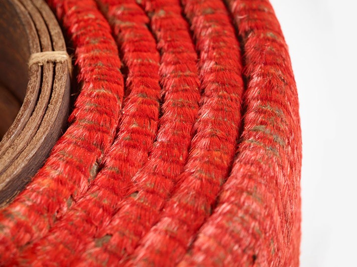 Tevau (red feather currency), feathers, 1900s; Santa Cruz Islands. Purchased 2012. Te Papa (FE012737) A coiled belt made of hundreds of small red feathers and leather in the middle.