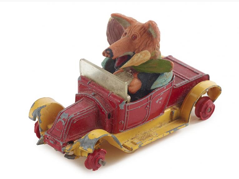 Toy car with Basil Brush, circa 1971, Great Britain, by Mettoy Playcraft Limited. Gift of Mrs J. R. Smart, 2012. CC BY-NC-ND 4.0. Te Papa (GH022185) A toy fox dressed in clothing is driving a toy car