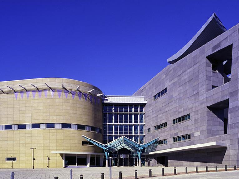 The outside of a large building on a sunny day