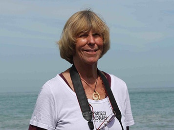 Barbara Todd Head and shoulders of a woman smiling. The ocean is in the background.
