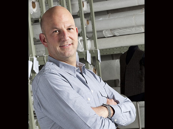 Head and shoulders of a man smiling at the camera