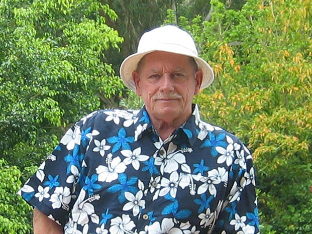 Foss Leach A man in a white hat and a blue and white floral shirt.