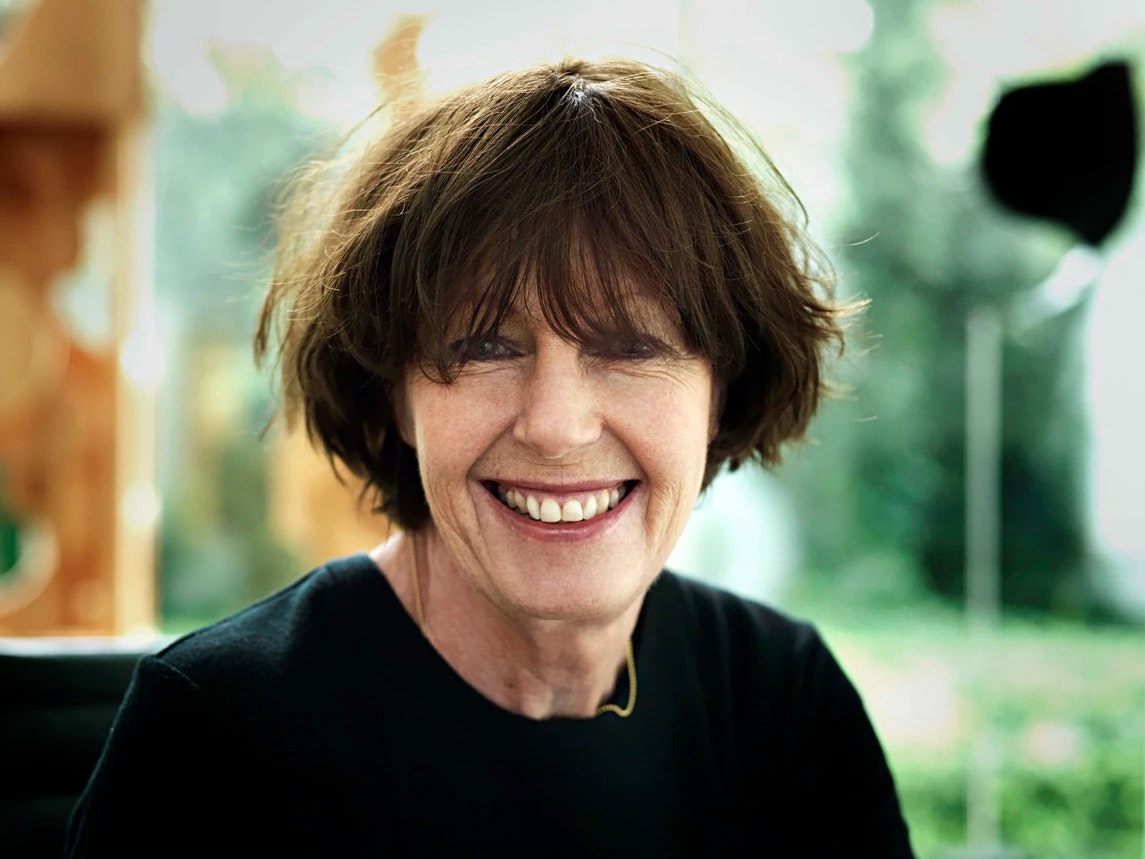 Jane Ussher. Photo by Jane Ussher Head and shoulders photo of a woman with short dark hair. She is smiling at the camera.