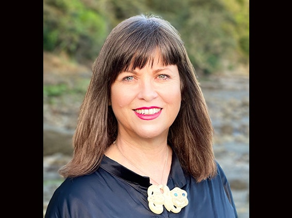 Natalie Robertson Head and shoulders photo of a woman with long brown hair.