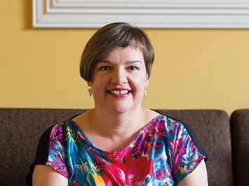 Bronwyn Labrum, 2015. Photograph by Michael Hall. Te Papa (91082) Head and shoulders of a woman with short hair smiling at the camera.