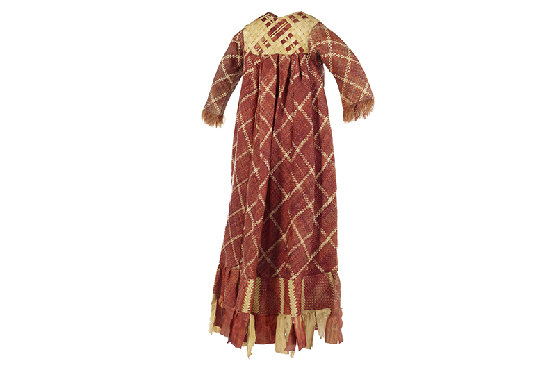 A red and natural dye coloured dress made with plant fibre, dye, and cotton