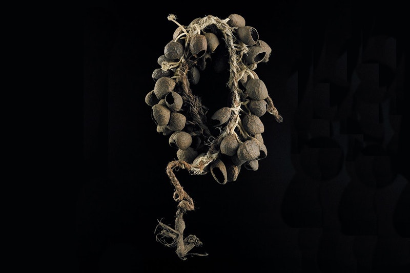 A leg rattle with seed pods on a rope.