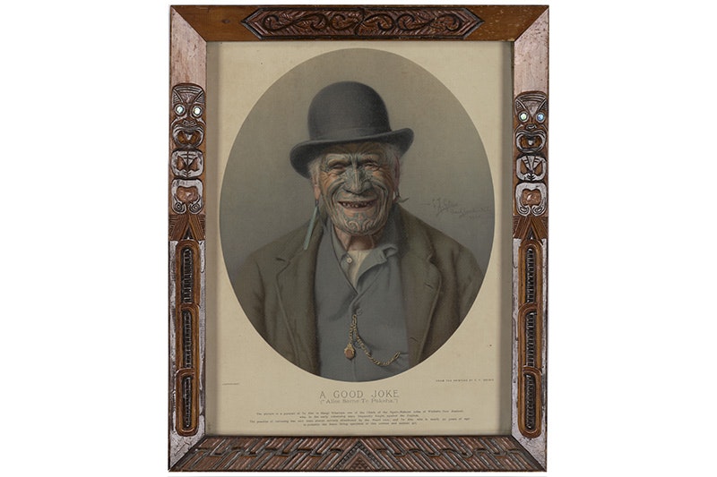 A painting of a man who has a facial tattoo and is wearing a bowler hat. The painting is in a frame that has Māori carving on it.